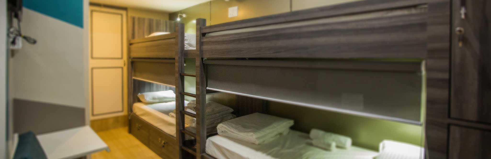 Wood-lined sleeping pods with fresh linen at Pod n Beyond, Jamshedpur